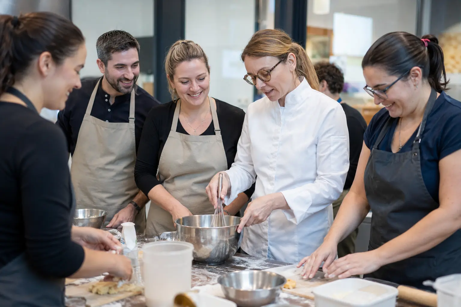 Guests learning Czech pastry with pastry chef Lucie Průšová in a professional studio near Prague